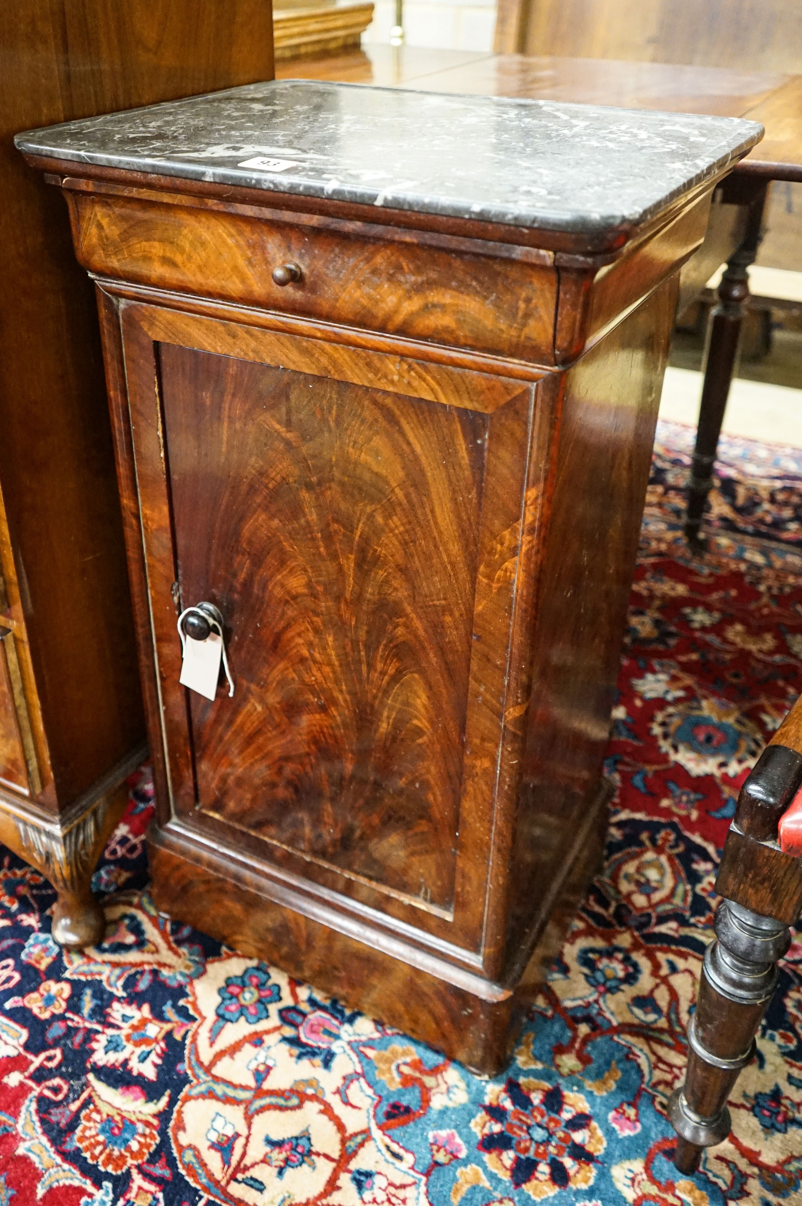 A Victorian mahogany commode cupboard with grey marble top, width 93cm, depth 36cm, height 75cm together with a pair of Victorian rosewood kidney back dining chairs